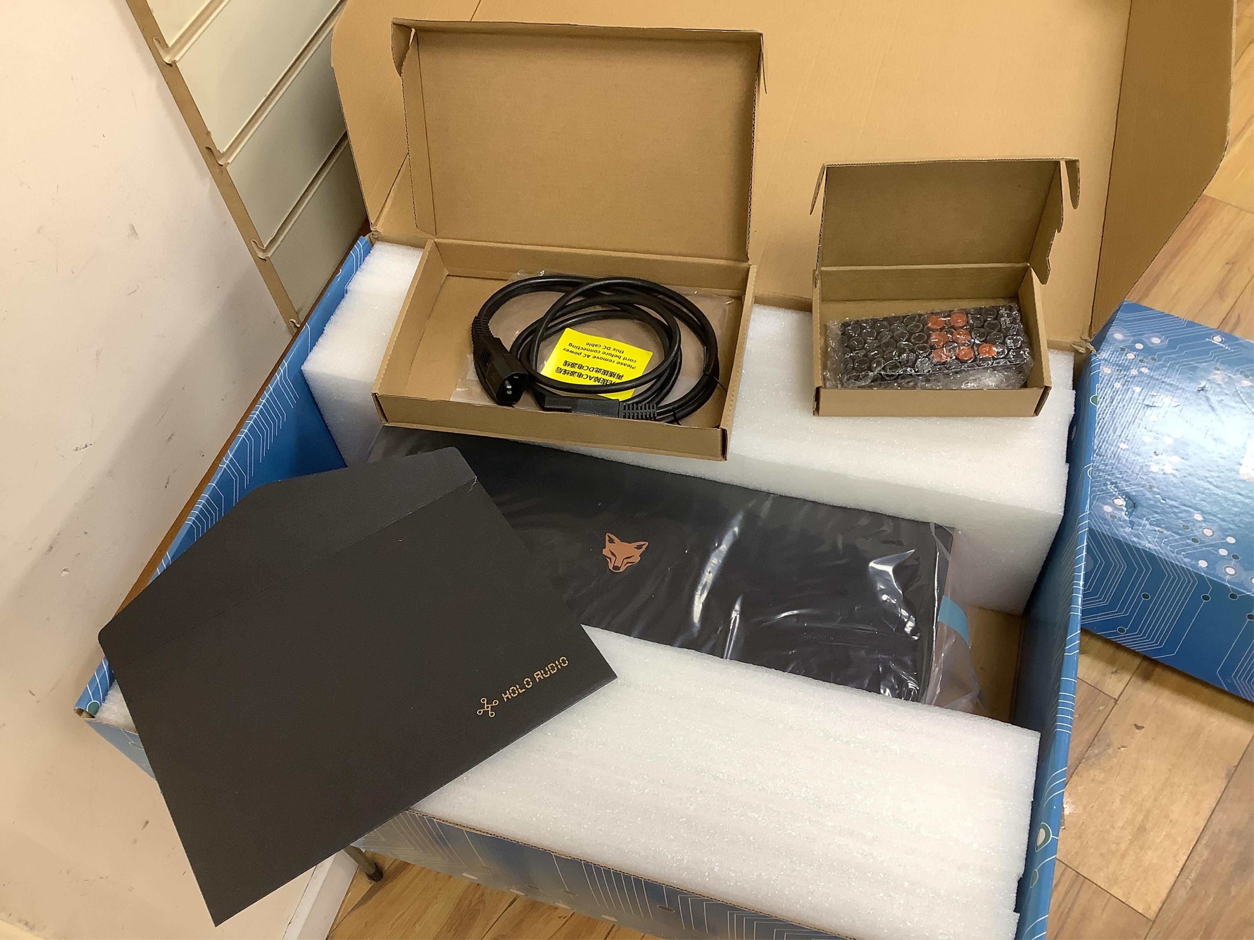 A Holo Audio May R2R digital analog converter (DAC) with linear compensation, contained within its original box and packaging, with owners manual, etc. Condition - good, appears unused. Sold untested.